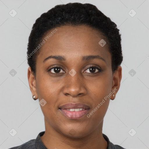 Joyful black young-adult female with short  black hair and brown eyes