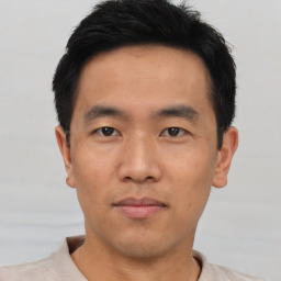 Neutral asian young-adult male with short  black hair and brown eyes