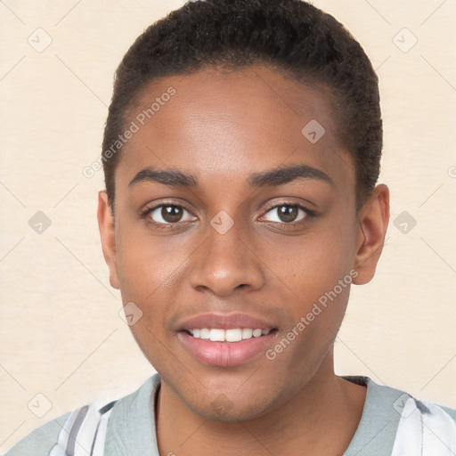 Joyful black young-adult female with short  brown hair and brown eyes