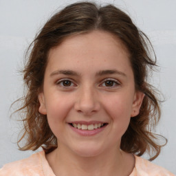 Joyful white child female with medium  brown hair and brown eyes