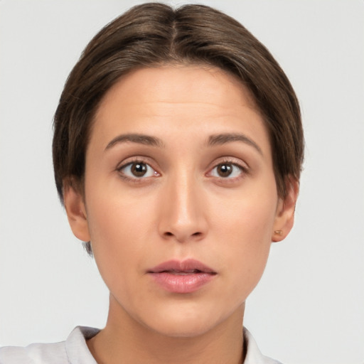 Neutral white young-adult female with short  brown hair and brown eyes