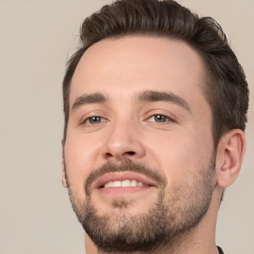 Joyful white young-adult male with short  brown hair and brown eyes