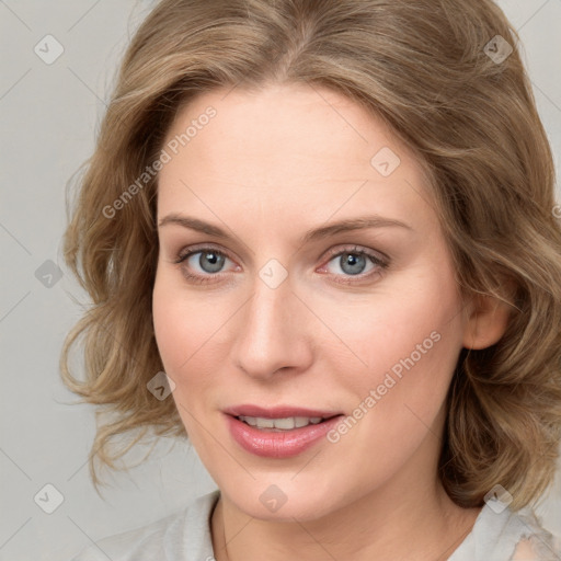 Joyful white young-adult female with medium  brown hair and blue eyes