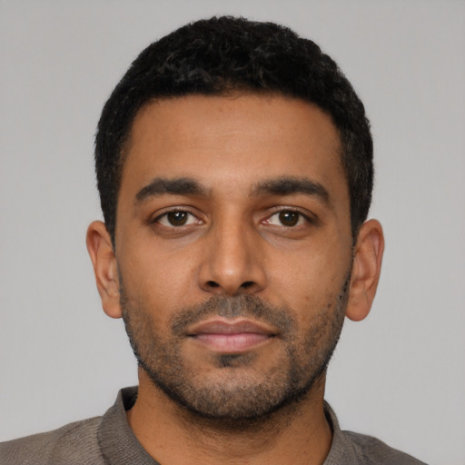 Neutral latino young-adult male with short  black hair and brown eyes