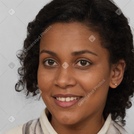 Joyful black young-adult female with long  brown hair and brown eyes