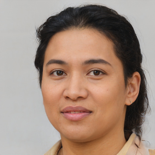 Joyful asian young-adult female with medium  brown hair and brown eyes