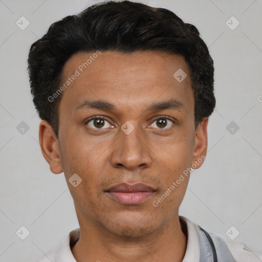 Joyful latino young-adult male with short  black hair and brown eyes