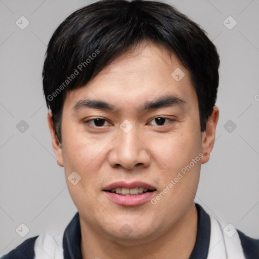 Joyful asian young-adult male with short  black hair and brown eyes