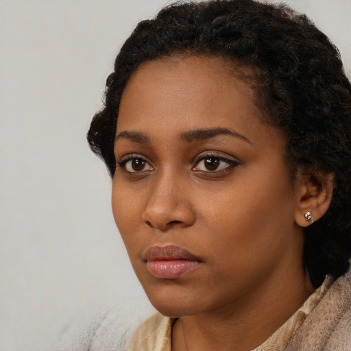 Neutral black young-adult female with short  black hair and brown eyes