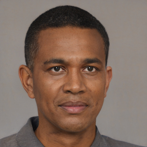 Neutral black adult male with short  black hair and brown eyes