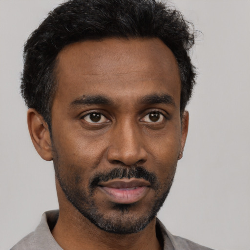 Neutral black young-adult male with short  black hair and brown eyes
