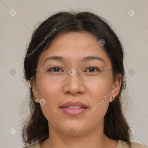 Joyful white adult female with medium  brown hair and brown eyes