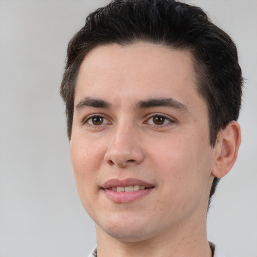 Joyful white young-adult male with short  brown hair and brown eyes