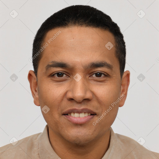 Joyful latino young-adult male with short  black hair and brown eyes