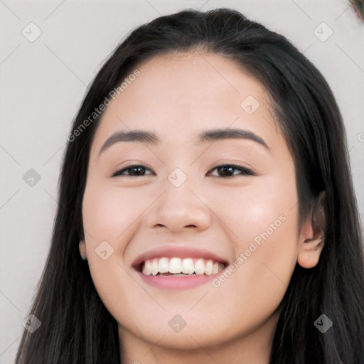 Joyful white young-adult female with long  black hair and brown eyes