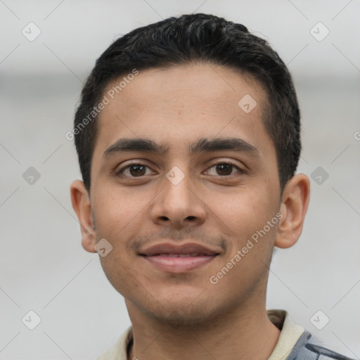 Joyful latino young-adult male with short  black hair and brown eyes