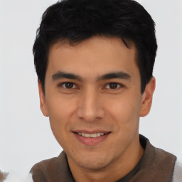 Joyful asian young-adult male with short  black hair and brown eyes