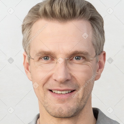 Joyful white adult male with short  brown hair and grey eyes