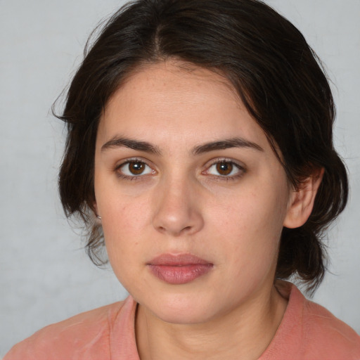 Neutral white young-adult female with medium  brown hair and brown eyes