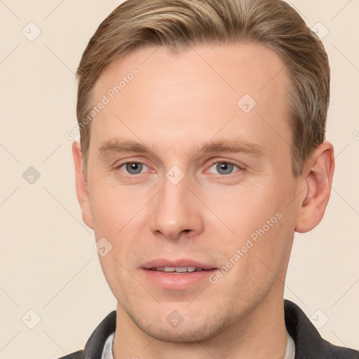 Joyful white adult male with short  brown hair and grey eyes