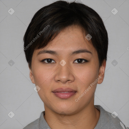 Joyful asian young-adult female with short  brown hair and brown eyes