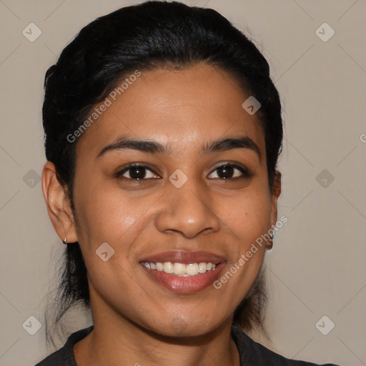 Joyful latino young-adult female with short  black hair and brown eyes