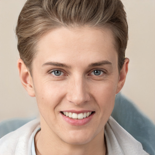 Joyful white young-adult female with short  brown hair and grey eyes