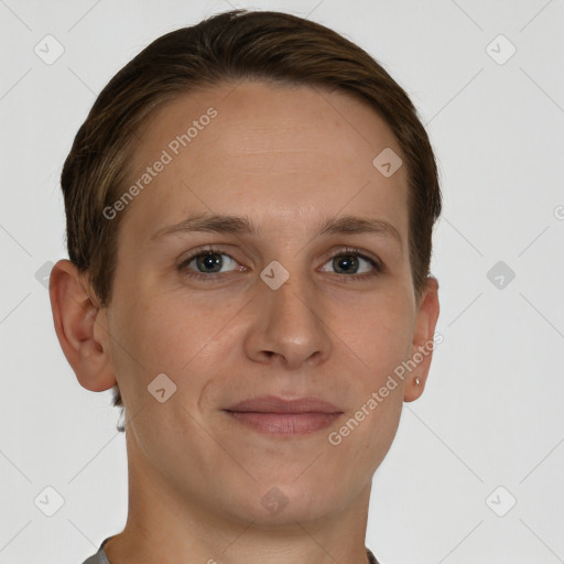 Joyful white young-adult female with short  brown hair and grey eyes