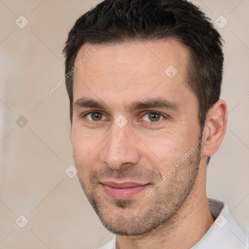 Joyful white adult male with short  brown hair and brown eyes