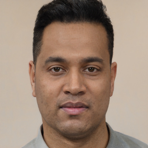 Neutral latino young-adult male with short  black hair and brown eyes