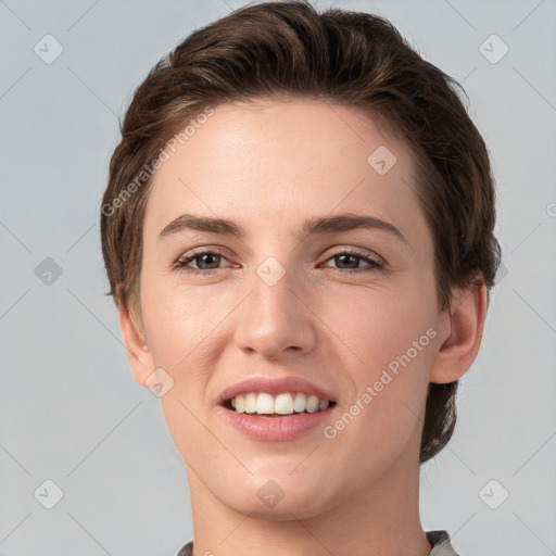 Joyful white young-adult female with short  brown hair and grey eyes