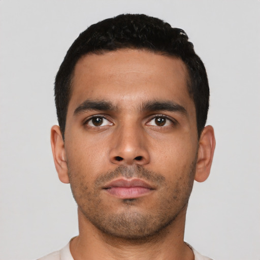 Neutral latino young-adult male with short  black hair and brown eyes