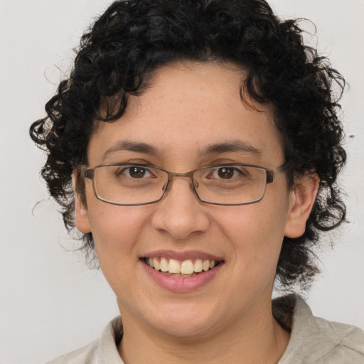 Joyful white adult female with short  brown hair and brown eyes