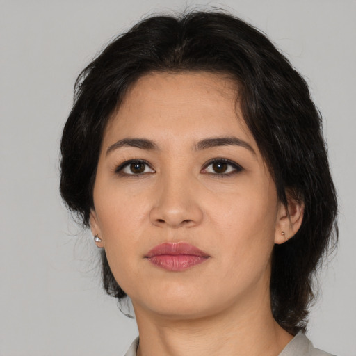 Neutral latino young-adult female with medium  black hair and brown eyes