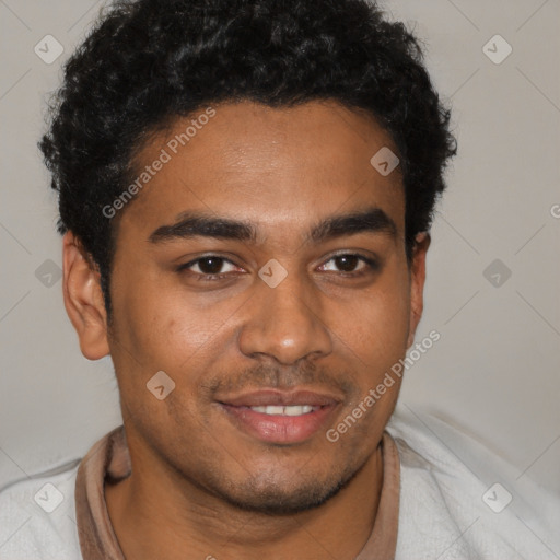 Joyful black young-adult male with short  brown hair and brown eyes