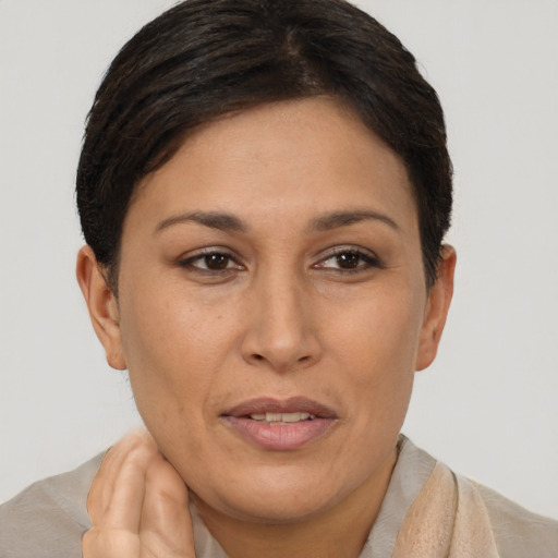 Joyful asian adult female with short  brown hair and brown eyes