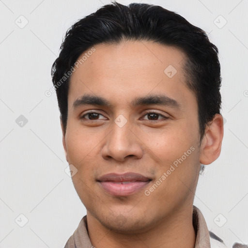 Joyful latino young-adult male with short  black hair and brown eyes