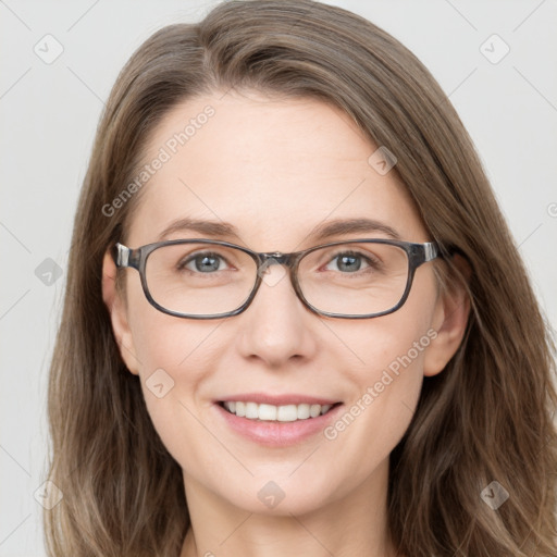 Joyful white young-adult female with long  brown hair and blue eyes