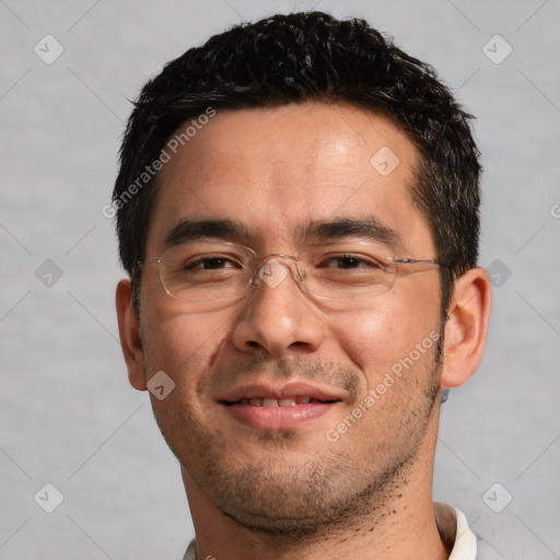 Joyful white adult male with short  black hair and brown eyes