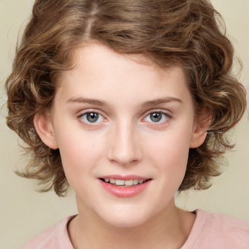 Joyful white child female with medium  brown hair and green eyes