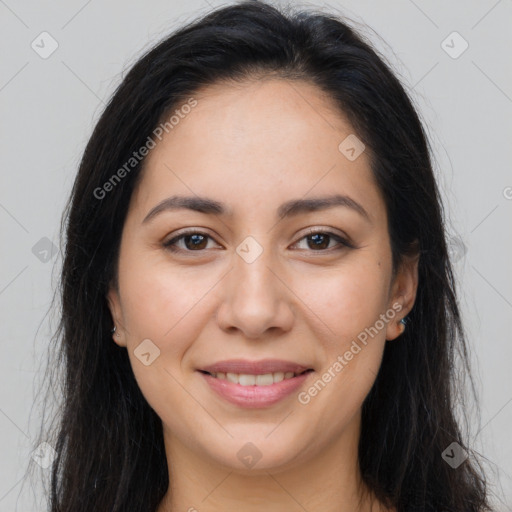 Joyful latino young-adult female with long  brown hair and brown eyes