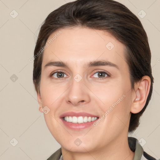 Joyful white young-adult female with medium  brown hair and brown eyes