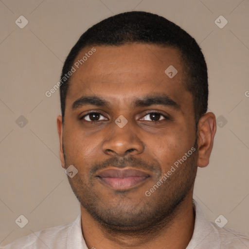 Joyful black young-adult male with short  black hair and brown eyes