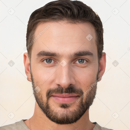 Joyful white young-adult male with short  brown hair and brown eyes