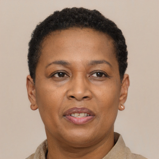 Joyful latino adult female with short  brown hair and brown eyes