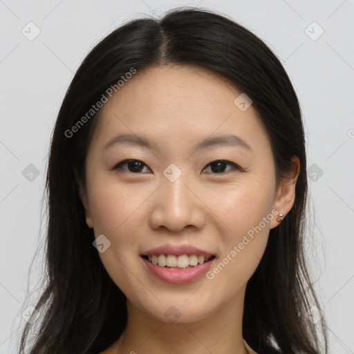 Joyful asian young-adult female with long  brown hair and brown eyes