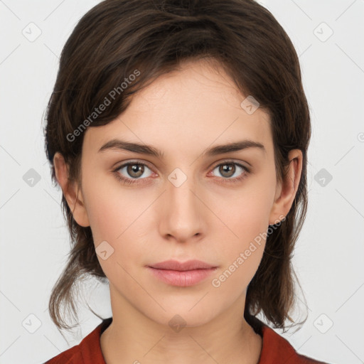 Neutral white young-adult female with medium  brown hair and brown eyes