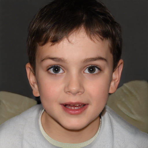 Joyful white child male with short  brown hair and brown eyes