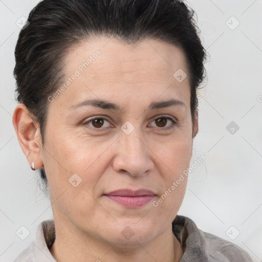 Joyful white adult female with short  brown hair and brown eyes