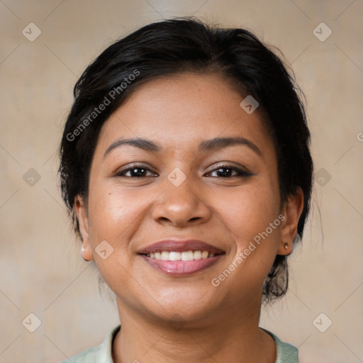 Joyful latino young-adult female with medium  brown hair and brown eyes